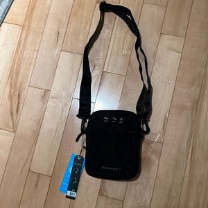 New with tags Sherpani Suki handbag in black